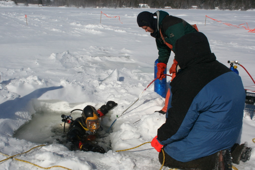 Diving to recover 28,000 pound skidder. Vehicle went through the ice at Longfellow Lake, Maine, in the winter of 2011.