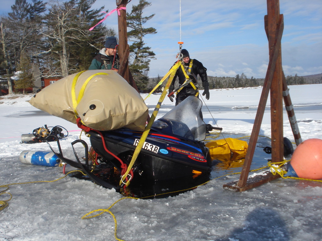 Recovery of snowmobile that had broken through the ice at Green Lake, Maine.