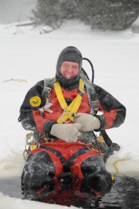 Canders diving services and Greg Canders assisting in recovering a sunken snowmobile that feel through the ice.