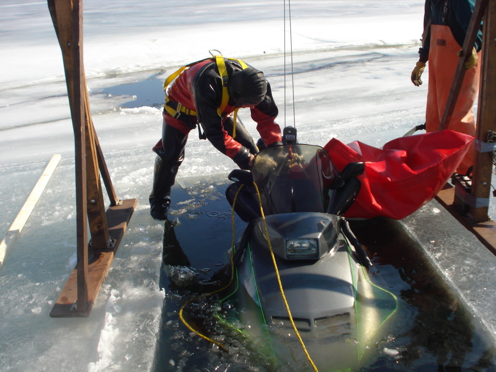 Recovery of a snowmobile from Moosehead Lake.