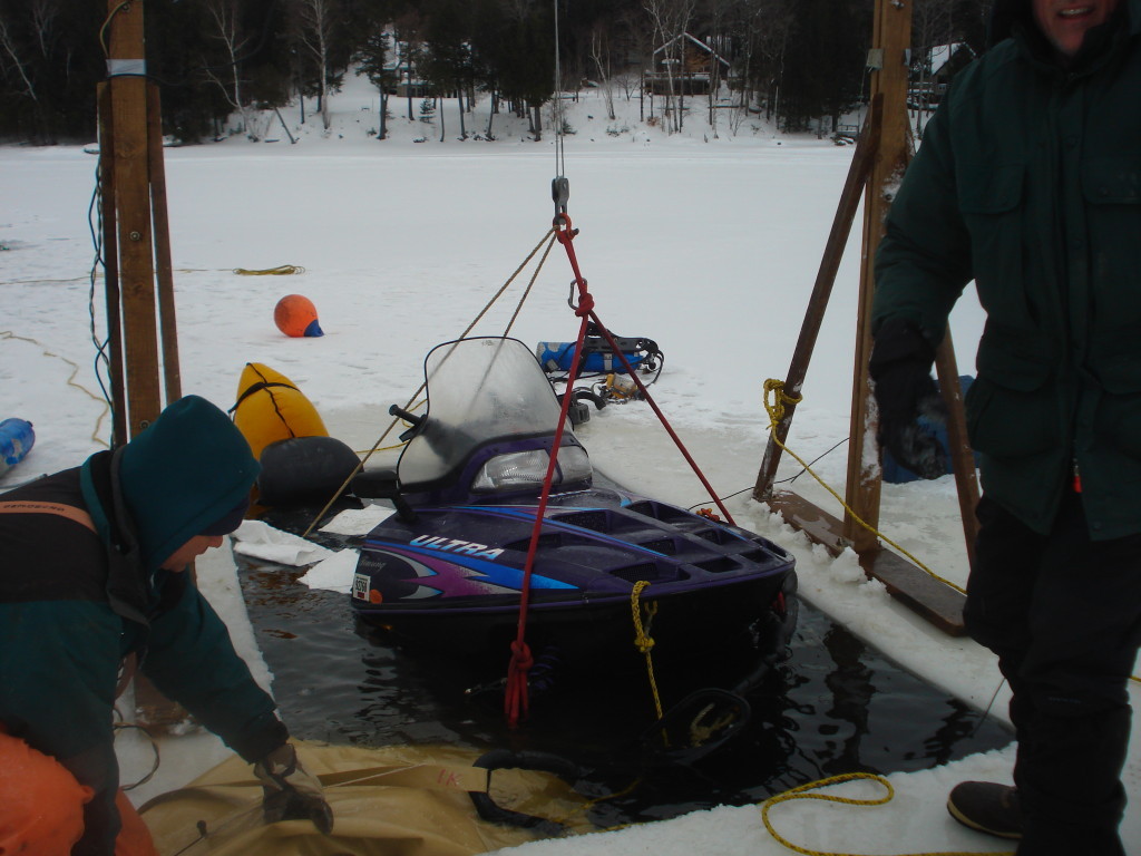 Recovery of snowmobile submerged in Sebec Lake.