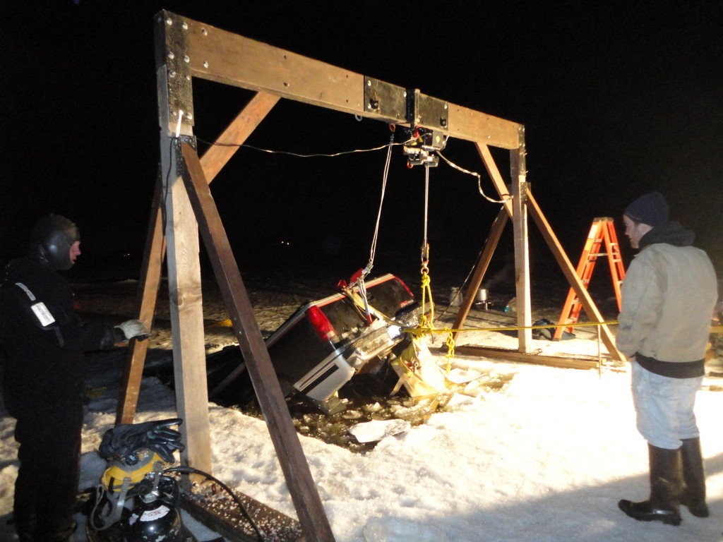 Pickup truck during recovery from under the ice of Hermon Pond, Maine.